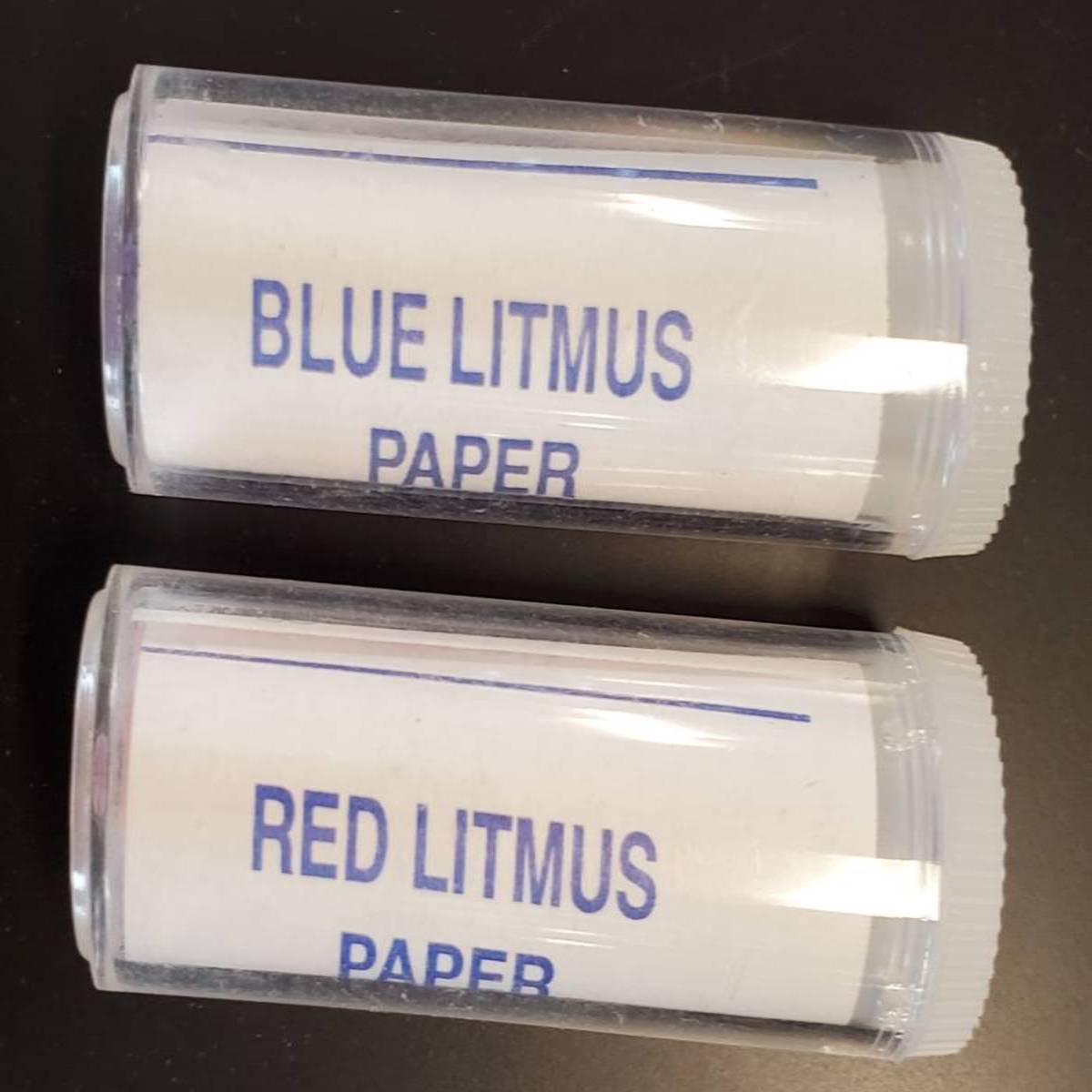 Picture of plastic vials containing red and blue litmus paper