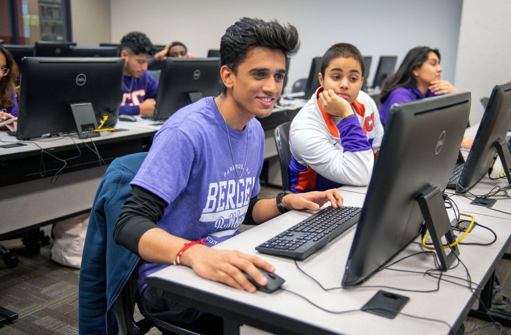 Students using a laptop to learn remotely.