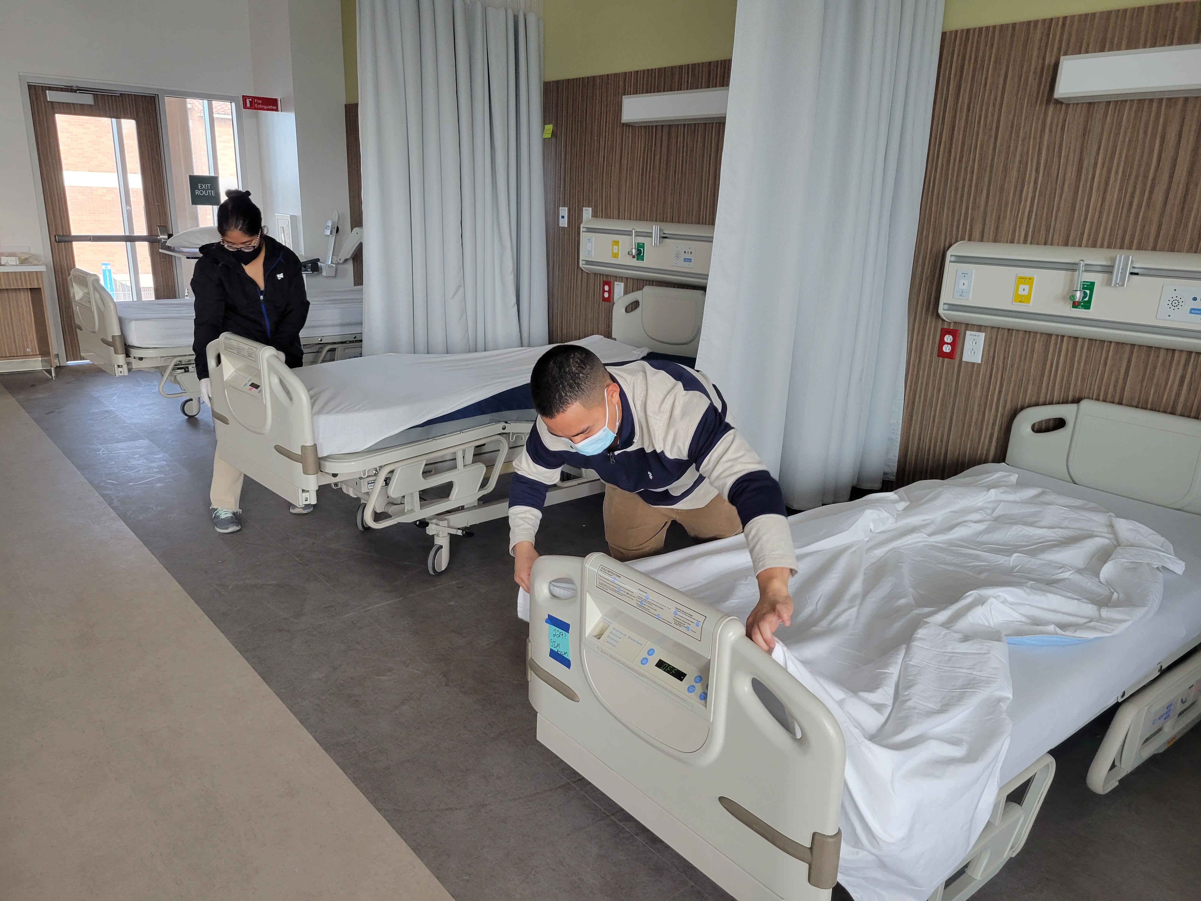 Volunteers setting up beds for nursing dept Volunteers setting up beds for nursing dept