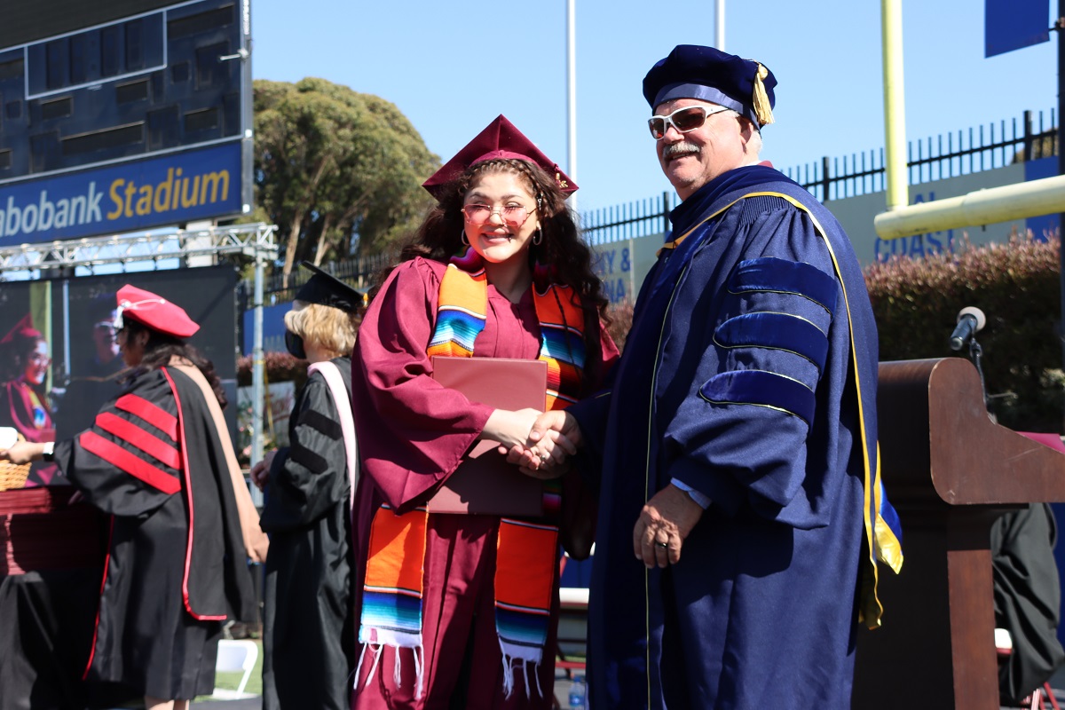 Photo of graduate receiving degree