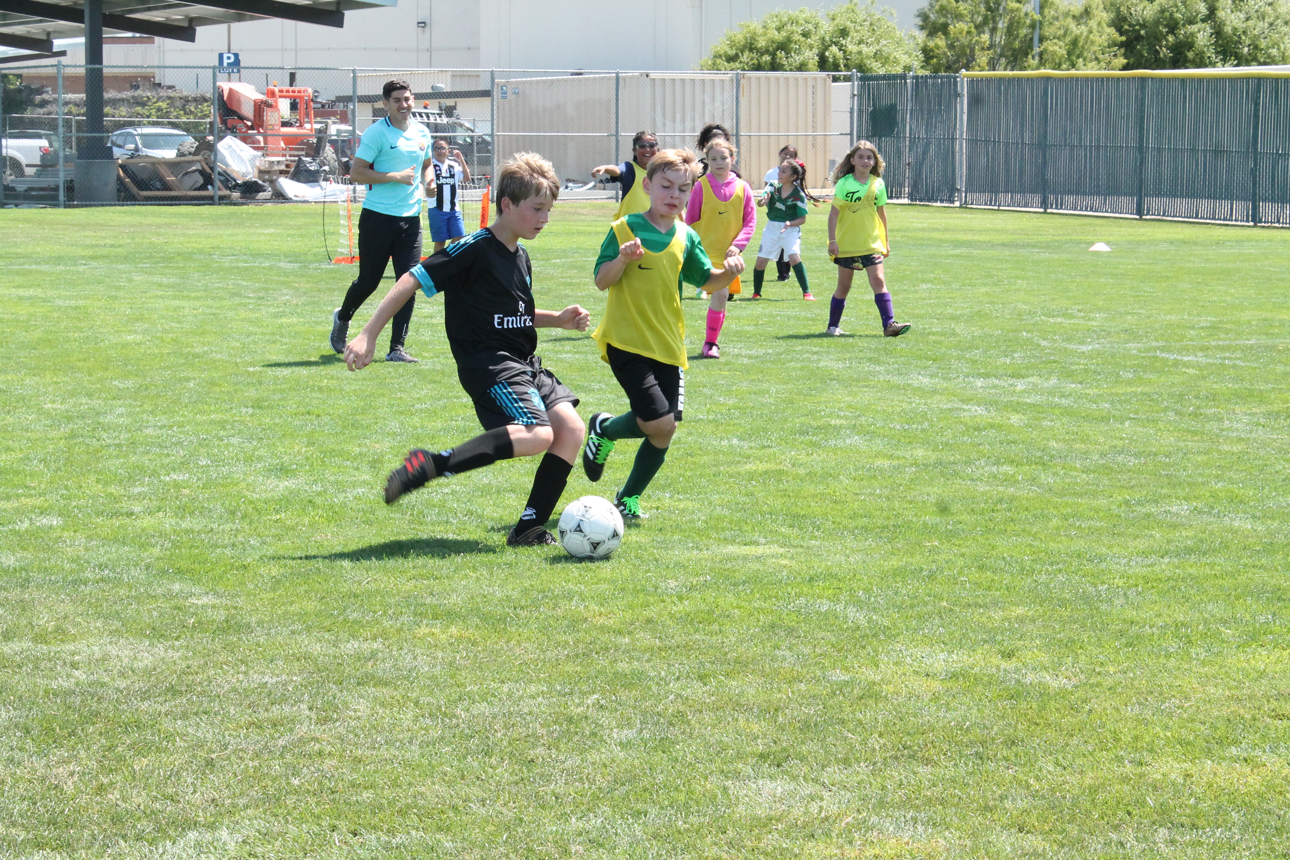 photo of kids playing coed soccer photo of kids playing coed soccer