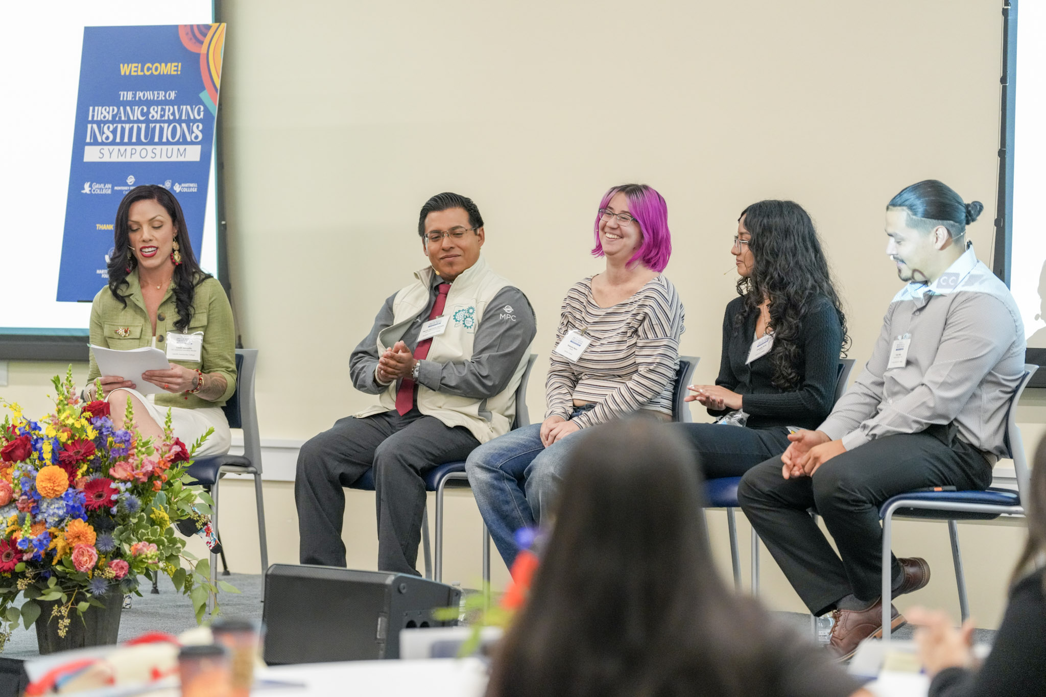 Panel discussion with moderator and four panelists at The Power of HSI Symposium.