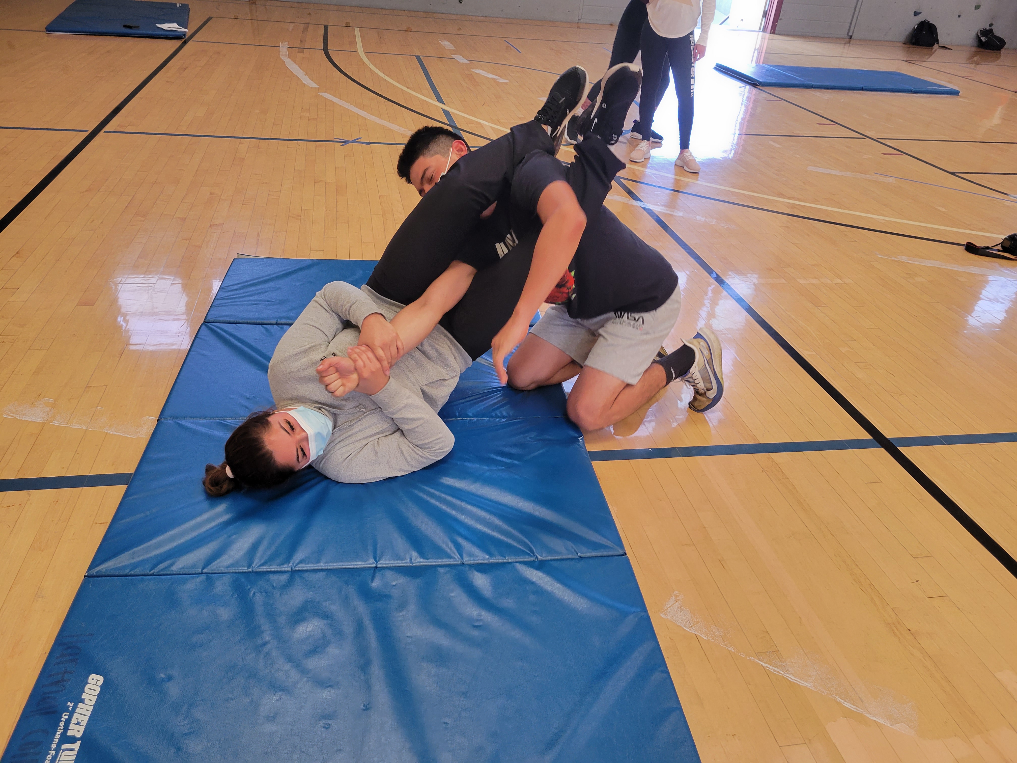students learning self-defense students learning self-defense